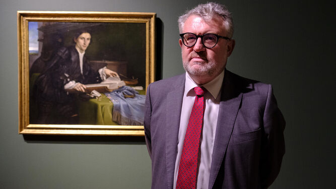 Miguel Falomir ante el 'Retrato de un joven' de Lorenzo Lotto
