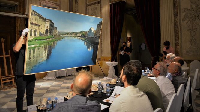 El jurado del concurso Figurativas Painting & Sculpture Competition observa 'Río Arno sobre el Puente Vecchio'.