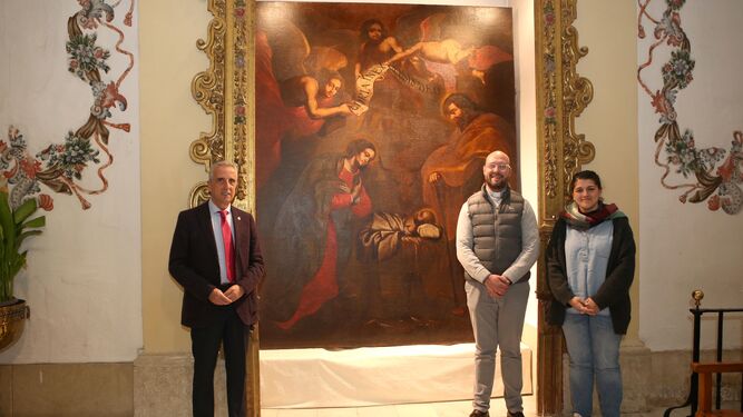 El cuadro 'El nacimiento de Jesús', ya restaurado, de nuevo en la parroquia Nuestra Señora del Carmen de Lucena.